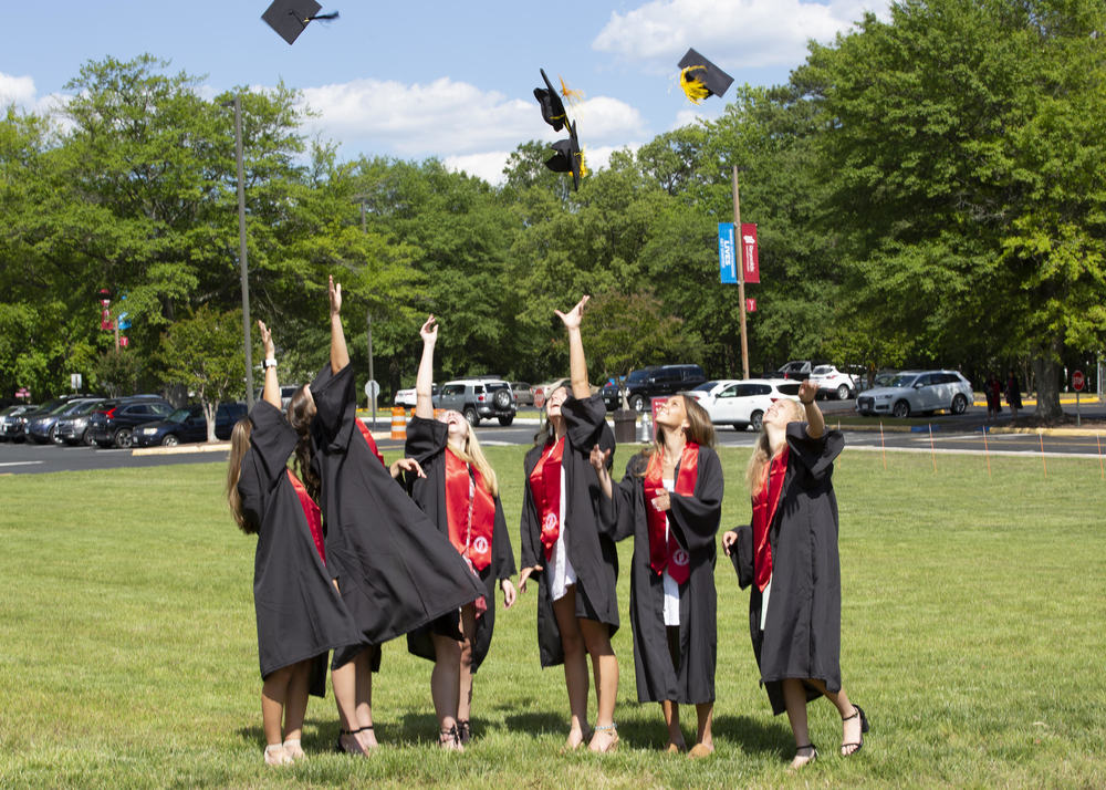 Graduates throwing their caps in the air