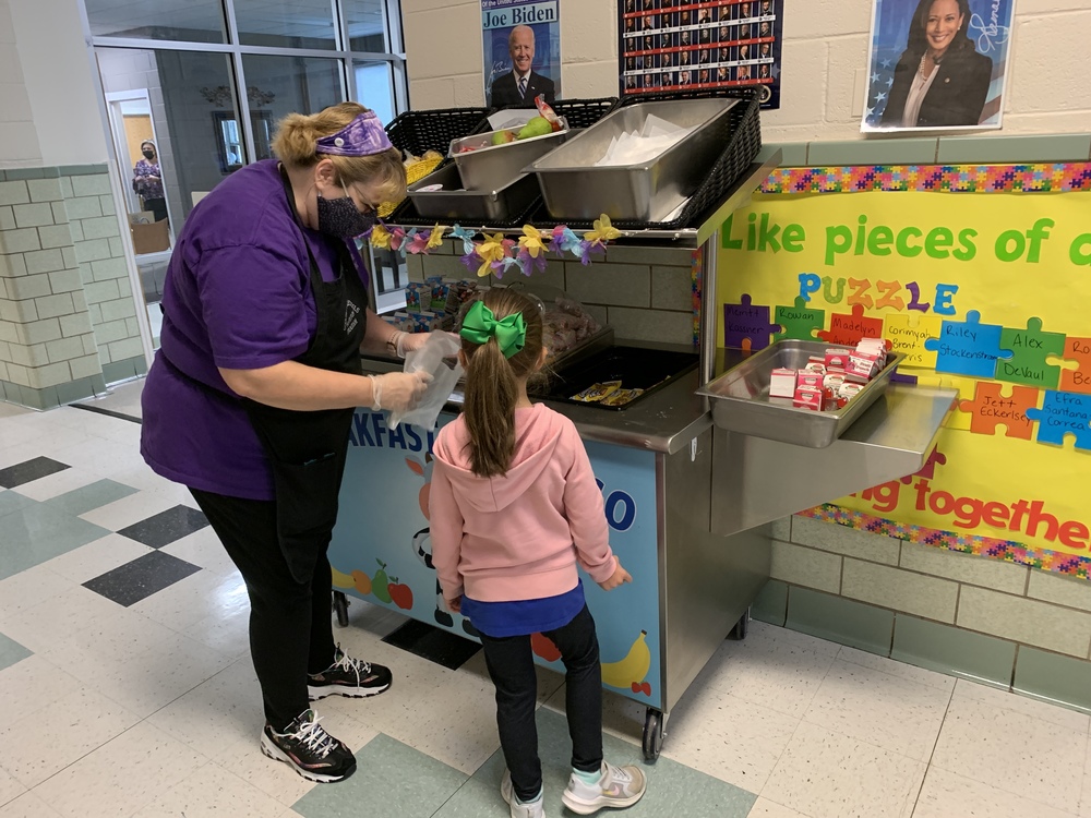 Staff serving Breakfast