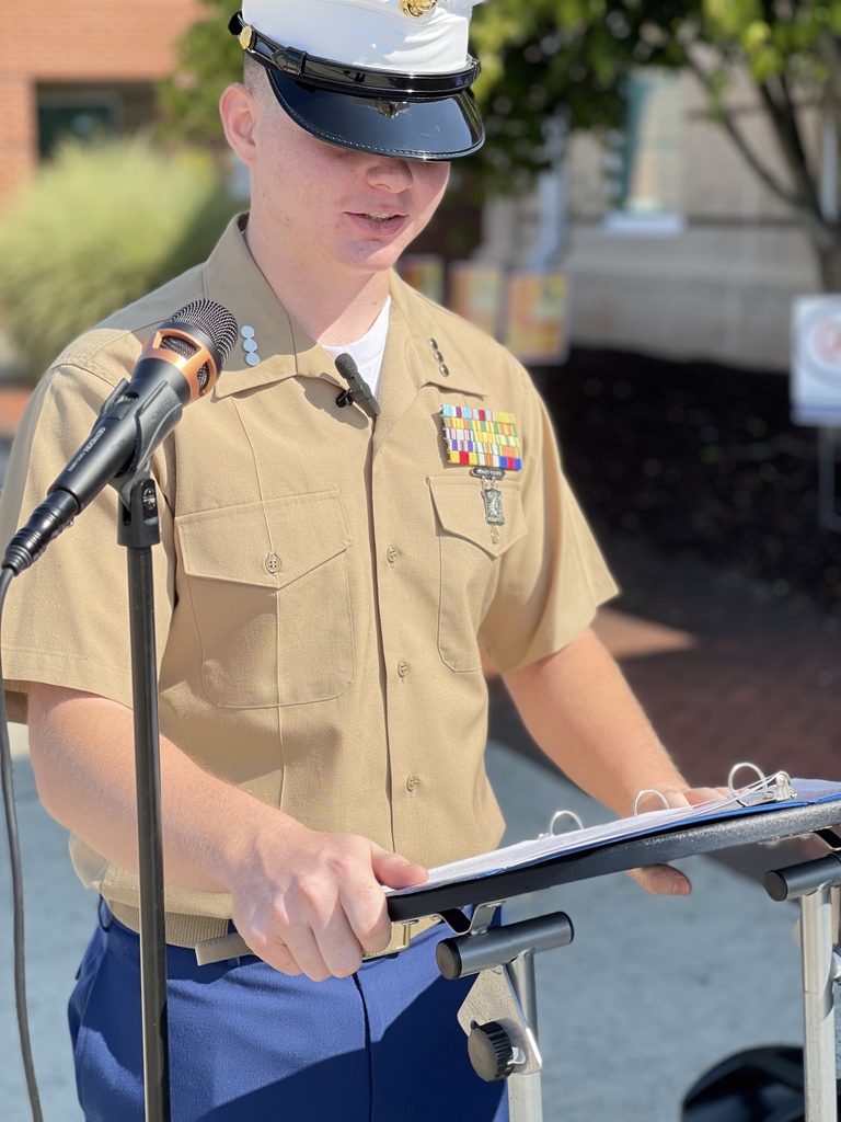 Student giving speech at the 9/11 memorial ceremony 