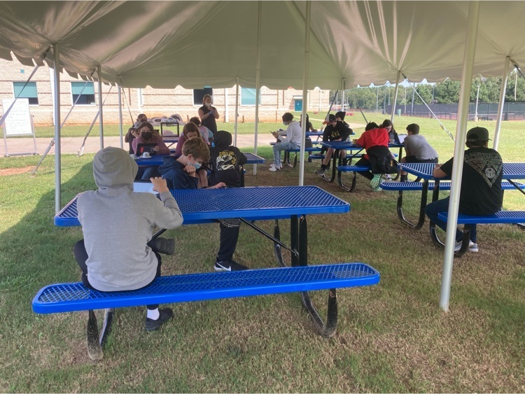 students at picnic tables