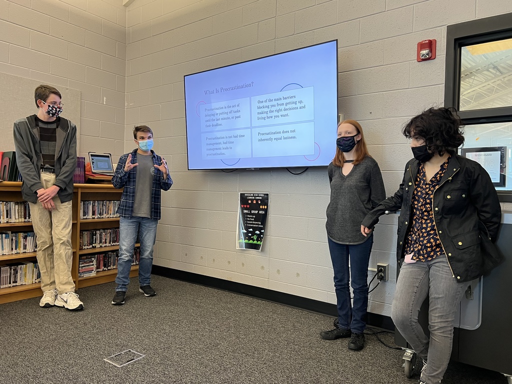 Students presenting in the LC
