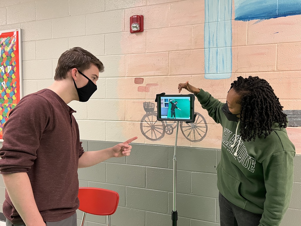 Student & Ms. Howell working on the green screen app